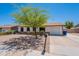 Charming single-story home featuring a well-manicured front yard, desert landscaping, and inviting curb appeal at 215 S 132Nd St, Chandler, AZ 85225