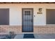 Close-up of the front door with a decorative security screen, house number and a 'welcome' mat at 215 S 132Nd St, Chandler, AZ 85225