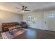 Inviting living room with hardwood floors, a ceiling fan, and comfortable seating arrangement at 215 S 132Nd St, Chandler, AZ 85225