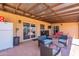 Spacious covered patio featuring seating area and a refrigerator for outdoor enjoyment at 215 S 132Nd St, Chandler, AZ 85225