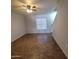 A bright living room boasts tile floors, a ceiling fan, and natural light, perfect for relaxation at 2367 E Huntington Dr, Phoenix, AZ 85040
