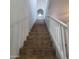 Staircase with tile steps and white railings leading upstairs, offering a seamless transition at 2367 E Huntington Dr, Phoenix, AZ 85040