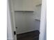 Clean walk-in closet with white walls, a rack for hanging clothes, and shelves for organized storage at 2367 E Huntington Dr, Phoenix, AZ 85040