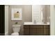 Modern bathroom with sleek vanity, stylish fixtures, and contemporary design elements at 24647 N 164Th Dr, Surprise, AZ 85387