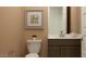 Modern bathroom featuring a stylish toilet, sleek vanity, and contemporary design at 24647 N 164Th Dr, Surprise, AZ 85387