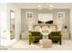 Well-lit bedroom featuring a comfortable bed, cozy seating area, and elegant decor at 24647 N 164Th Dr, Surprise, AZ 85387