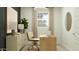 Bright office with a contemporary desk, neutral color palette, and stylish decorative accents at 24647 N 164Th Dr, Surprise, AZ 85387