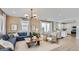 Bright living room featuring a sectional sofa, natural light, and an open concept design at 24649 N 164Th Dr, Surprise, AZ 85387