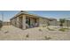 Relaxing covered patio with comfortable seating in a low-maintenance yard with lovely desert landscaping at 24962 N 174Th Ave, Surprise, AZ 85387