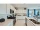 Modern kitchen with stainless steel appliances and white cabinetry at 24962 N 174Th Ave, Surprise, AZ 85387