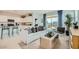 Open concept living and kitchen space with breakfast bar and modern décor at 24962 N 174Th Ave, Surprise, AZ 85387