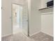 Walk-in closet with double doors leading to a bathroom at 24962 N 174Th Ave, Surprise, AZ 85387