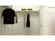 Organized walk-in closet with ample storage space and hanging rods at 25004 N 174Th Ave, Surprise, AZ 85387