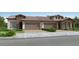 Charming paired home featuring brick accents, a tile roof, and a two-car garage at 25004 N 174Th Ave, Surprise, AZ 85387