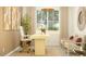 Bright home office with a modern desk, comfortable seating, and natural light at 25004 N 174Th Ave, Surprise, AZ 85387