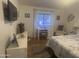 Comfortable bedroom featuring a desk, chair, bed, and plenty of natural light at 300 S Val Vista Dr # 54, Mesa, AZ 85204