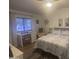 Bright bedroom with a desk, chair, comfortable bed, and ample natural light at 300 S Val Vista Dr # 54, Mesa, AZ 85204