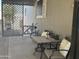Inviting covered patio featuring outdoor seating, a table, and lattice privacy screens at 300 S Val Vista Dr # 54, Mesa, AZ 85204