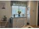 Charming kitchen nook with a view and decorative accents at 300 S Val Vista Dr # 54, Mesa, AZ 85204