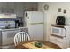 Well-lit kitchen showcases practical layout and standard appliances at 300 S Val Vista Dr # 54, Mesa, AZ 85204