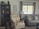 Cozy living room showcases comfortable seating and a bright window view at 300 S Val Vista Dr # 54, Mesa, AZ 85204