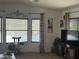 Bright living room boasts multiple windows, a cozy pet area, and ample space at 300 S Val Vista Dr # 54, Mesa, AZ 85204