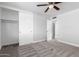 Spacious bedroom with carpet, closet, and ceiling fan offers a comfortable retreat at 3126 W Stella Ln, Phoenix, AZ 85017