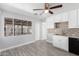 Well-lit kitchen featuring white cabinets, granite countertops, and stainless steel appliances at 3126 W Stella Ln, Phoenix, AZ 85017