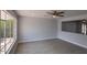 This living room has wood-look floors and a view into another room at 3126 W Stella Ln, Phoenix, AZ 85017