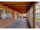 Enclosed sunroom features wood ceilings, backyard views, and ample light at 3126 W Stella Ln, Phoenix, AZ 85017