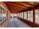Enclosed sunroom featuring wood ceiling, ample windows, and backyard view at 3126 W Stella Ln, Phoenix, AZ 85017