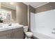 Clean bathroom featuring a shower-tub combo, gray vanity, and modern fixtures at 320 E Mckellips Rd # 45, Mesa, AZ 85201