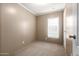 Simple, carpeted bedroom with ample natural light at 320 E Mckellips Rd # 45, Mesa, AZ 85201
