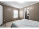 Bright bedroom with a large window, soft carpet, and neutral color palette at 320 E Mckellips Rd # 45, Mesa, AZ 85201