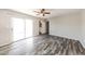 This modern bedroom is brightly lit and leads to an ensuite bathroom and backyard at 4833 N 63Rd Ln, Phoenix, AZ 85033
