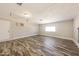 Versatile bonus room with wood flooring, neutral walls, and abundant natural light at 4833 N 63Rd Ln, Phoenix, AZ 85033