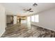 Open-concept living space featuring wood flooring and a bright, airy atmosphere at 4833 N 63Rd Ln, Phoenix, AZ 85033