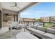Relaxing covered balcony with outdoor seating and a built-in barbecue area at 5250 E Deer Valley Dr # 140, Phoenix, AZ 85054