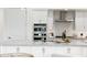 Stylish kitchen with stainless steel appliances, herringbone backsplash, and pendant lighting over the island at 5250 E Deer Valley Dr # 140, Phoenix, AZ 85054