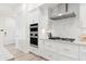 Well-lit kitchen equipped with stainless steel appliances, modern cabinets, and a sleek range hood at 5250 E Deer Valley Dr # 140, Phoenix, AZ 85054