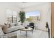 Inviting living room with neutral tones, stylish furniture, and expansive windows offering neighborhood views at 5250 E Deer Valley Dr # 140, Phoenix, AZ 85054