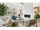 A stylish living room featuring a modern fireplace, comfortable seating, and lots of natural light at 5250 E Deer Valley Dr # 140, Phoenix, AZ 85054