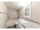 Bathroom with updated vanity with granite countertops and updated tub shower at 5533 W Sunnyside Dr, Glendale, AZ 85304