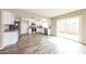 Open kitchen with stainless steel appliances, granite countertops, and a modern design at 5533 W Sunnyside Dr, Glendale, AZ 85304