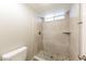 Updated tiled shower stall with decorative river rock floor at 5533 W Sunnyside Dr, Glendale, AZ 85304
