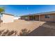 Spacious backyard with covered patio and tan storage shed, great for outdoor living and storage at 6022 E Colby St, Mesa, AZ 85205