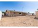 Expansive backyard view showing the home's exterior, including covered patio and storage shed at 6022 E Colby St, Mesa, AZ 85205