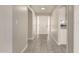 Bright hallway with updated tile flooring and neutral paint, leading to the main living areas at 6022 E Colby St, Mesa, AZ 85205