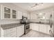 Modern kitchen with stainless steel appliances, granite countertops, and ample cabinet space at 6022 E Colby St, Mesa, AZ 85205
