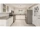 Updated kitchen featuring stainless steel appliances, granite countertops, and stylish tile flooring at 6022 E Colby St, Mesa, AZ 85205
